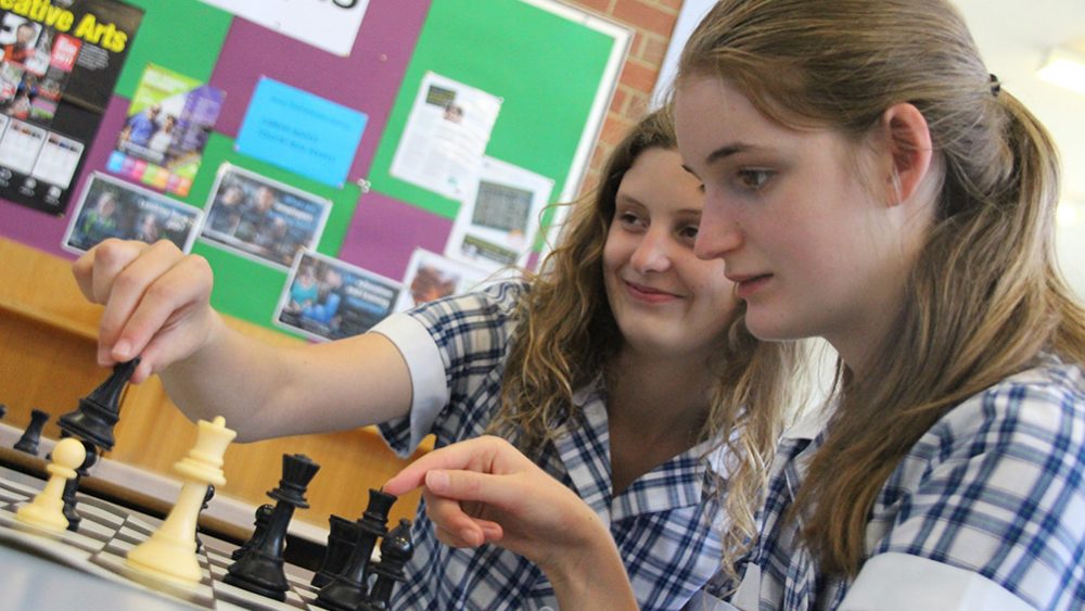 Girls playing chess